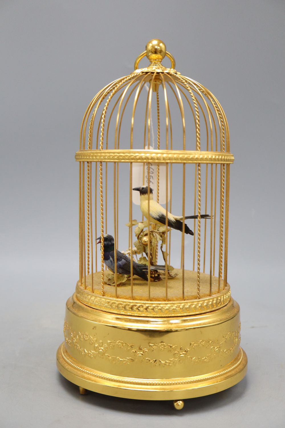 A two bird automaton in gilt metal cage, height 28cm